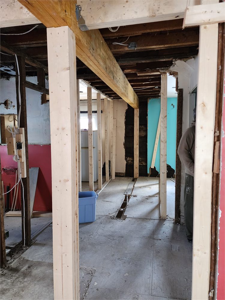 New beam and posts in place after a load-bearing wall was removed