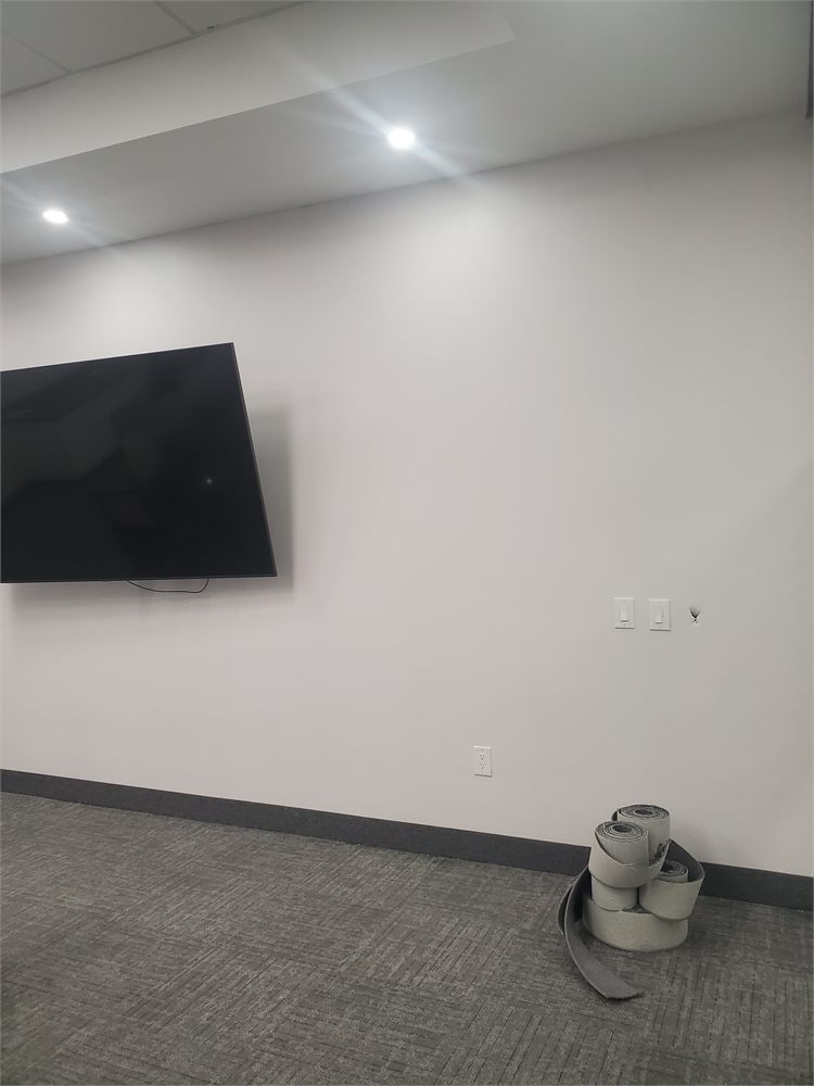 Meeting room wall after the drywall repair, taping and paint
